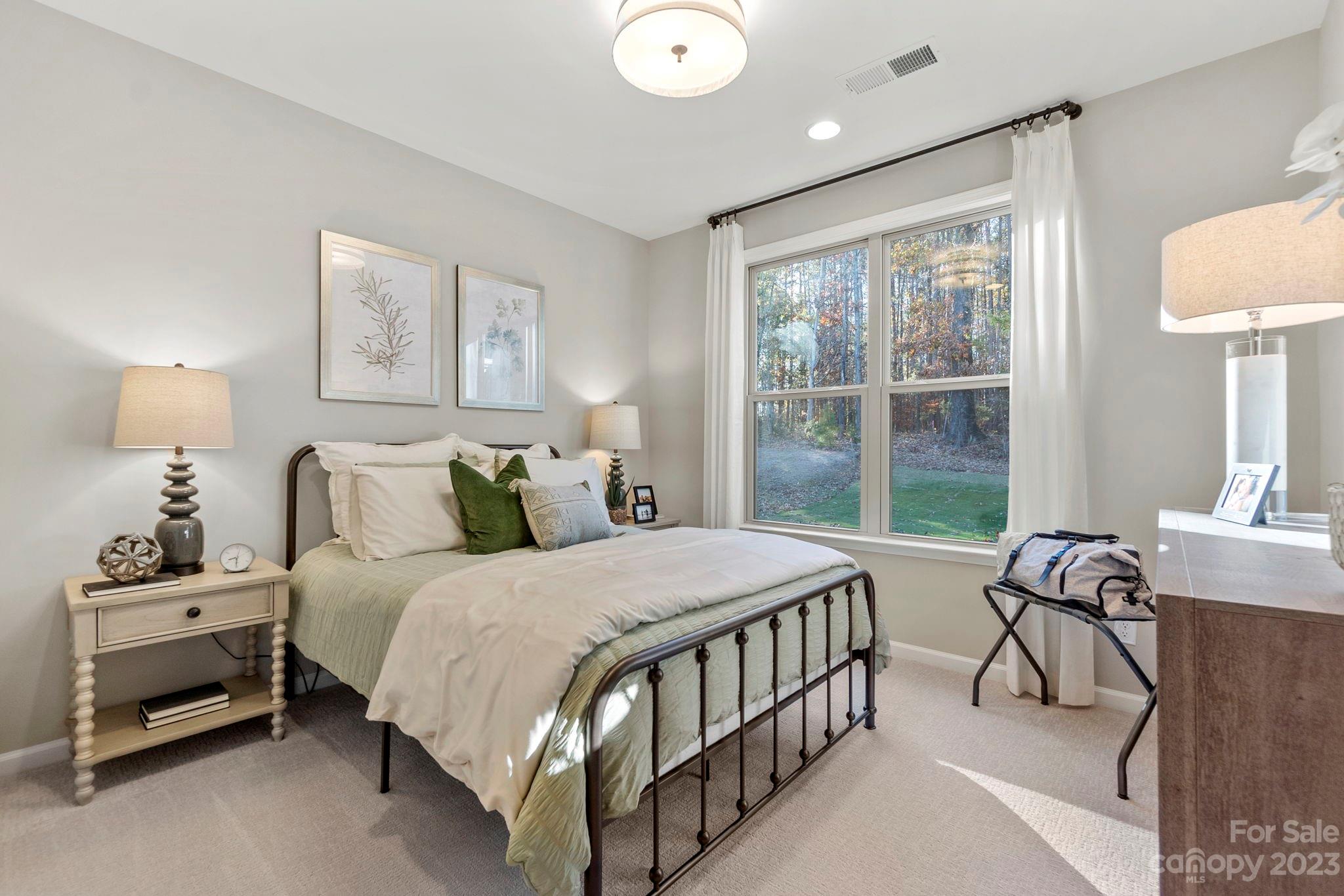 13220 Chopin Ridge Road Huntersville, NC 28078 - Photo 15 of 29 a bedroom with a bed and a table in it