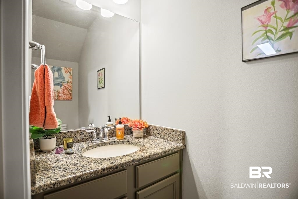 25806 Pollard Road, Unit 27 Daphne, AL 36526 - Photo 25 of 46 Half bathroom featuring vanity