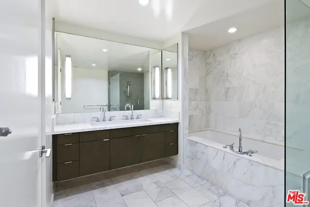 a view of a hallway with washer and dryer