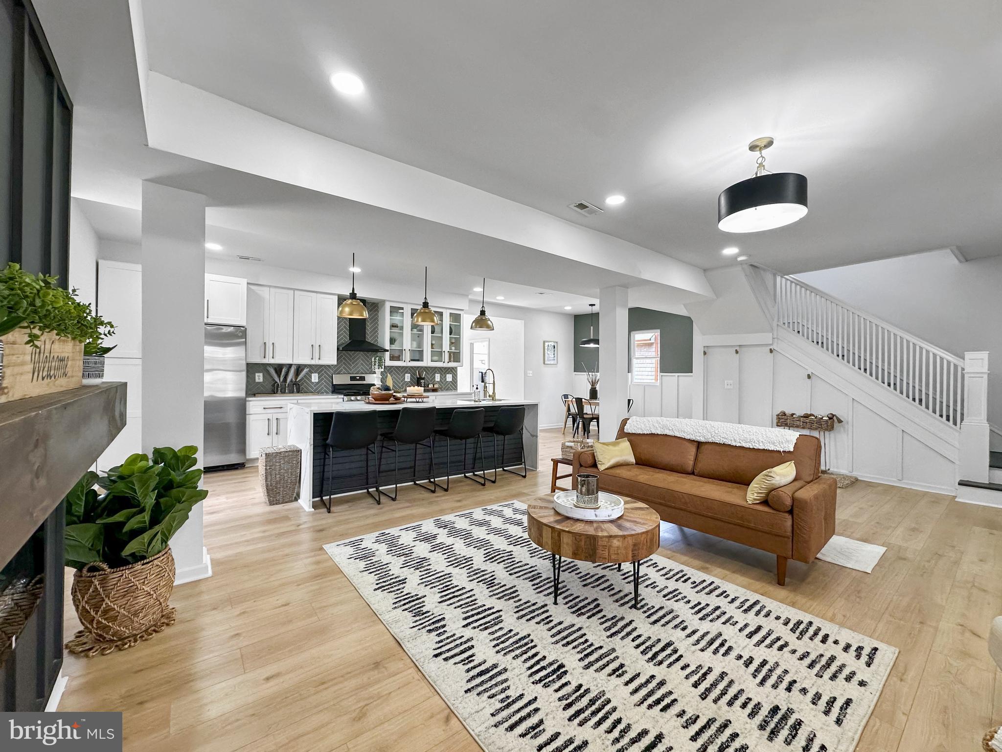 4309 Queensbury Road Riverdale, MD 20737 - Photo 11 of 63 a living room with furniture and a wooden floor