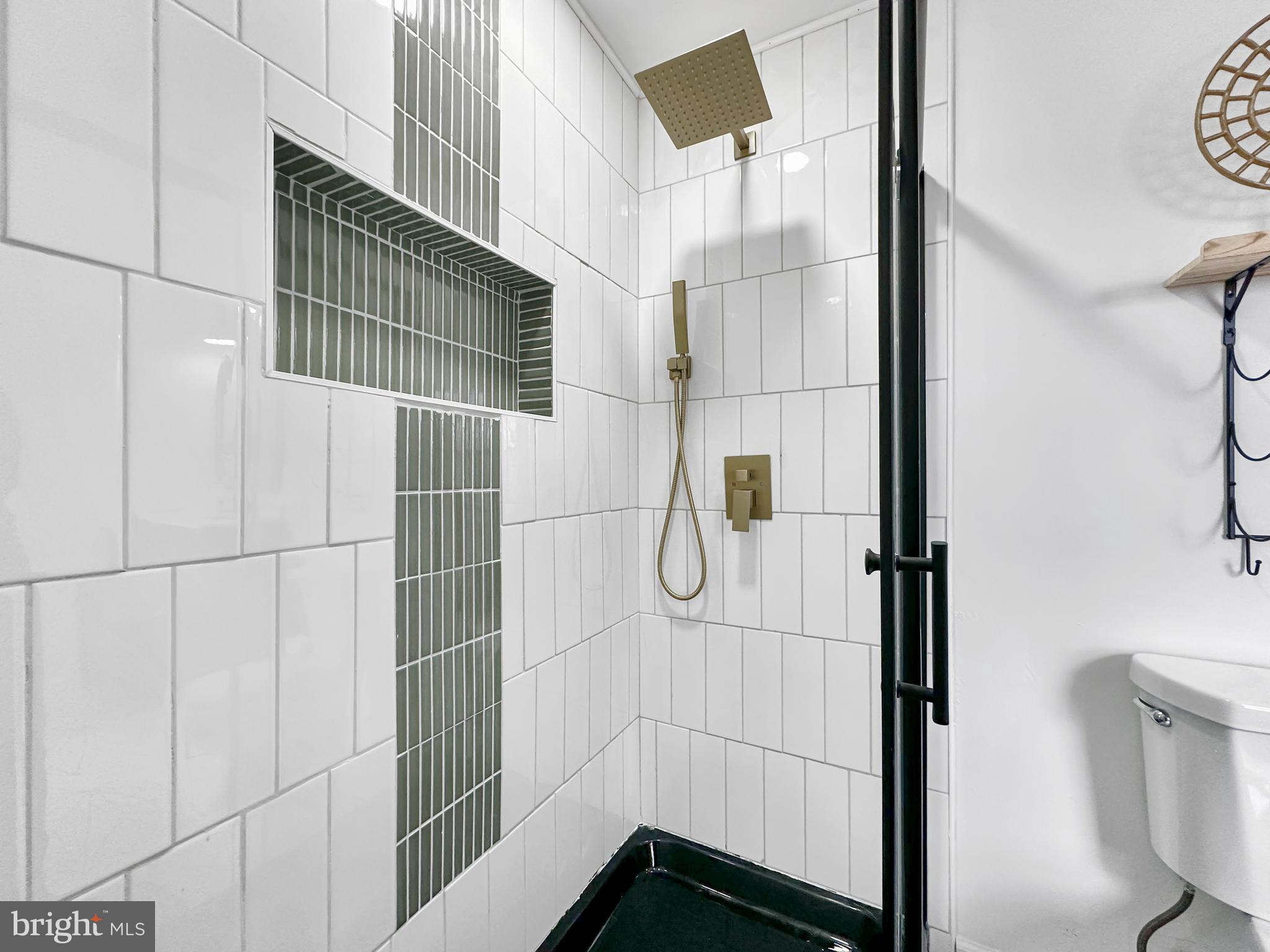 4309 Queensbury Road Riverdale, MD 20737 - Photo 38 of 63 a bathroom with a shower