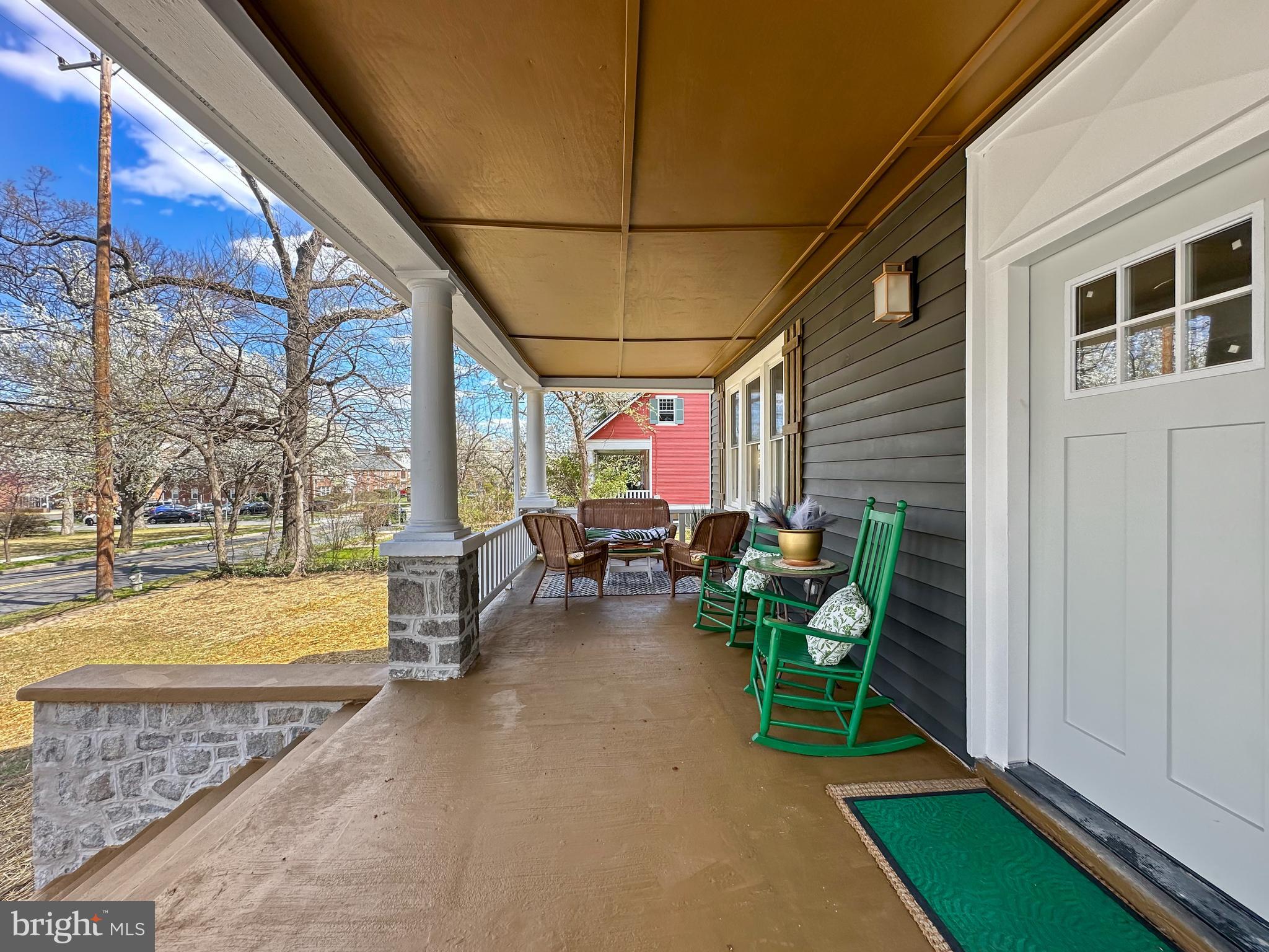 4309 Queensbury Road Riverdale, MD 20737 - Photo 4 of 63 a view of a patio with dining table and chairs with a barbeque grill and plants