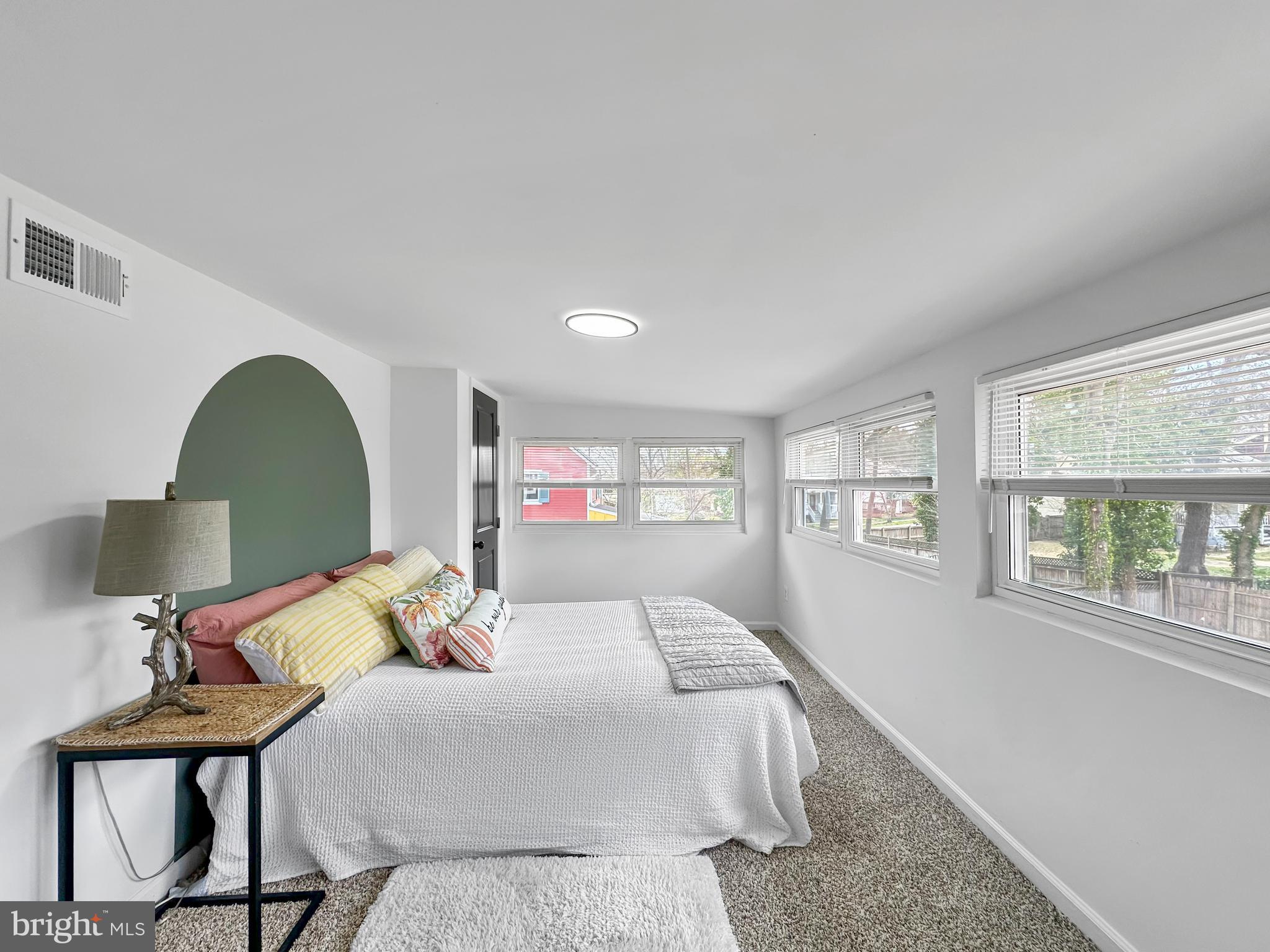 4309 Queensbury Road Riverdale, MD 20737 - Photo 41 of 63 a bedroom with a bed and a table