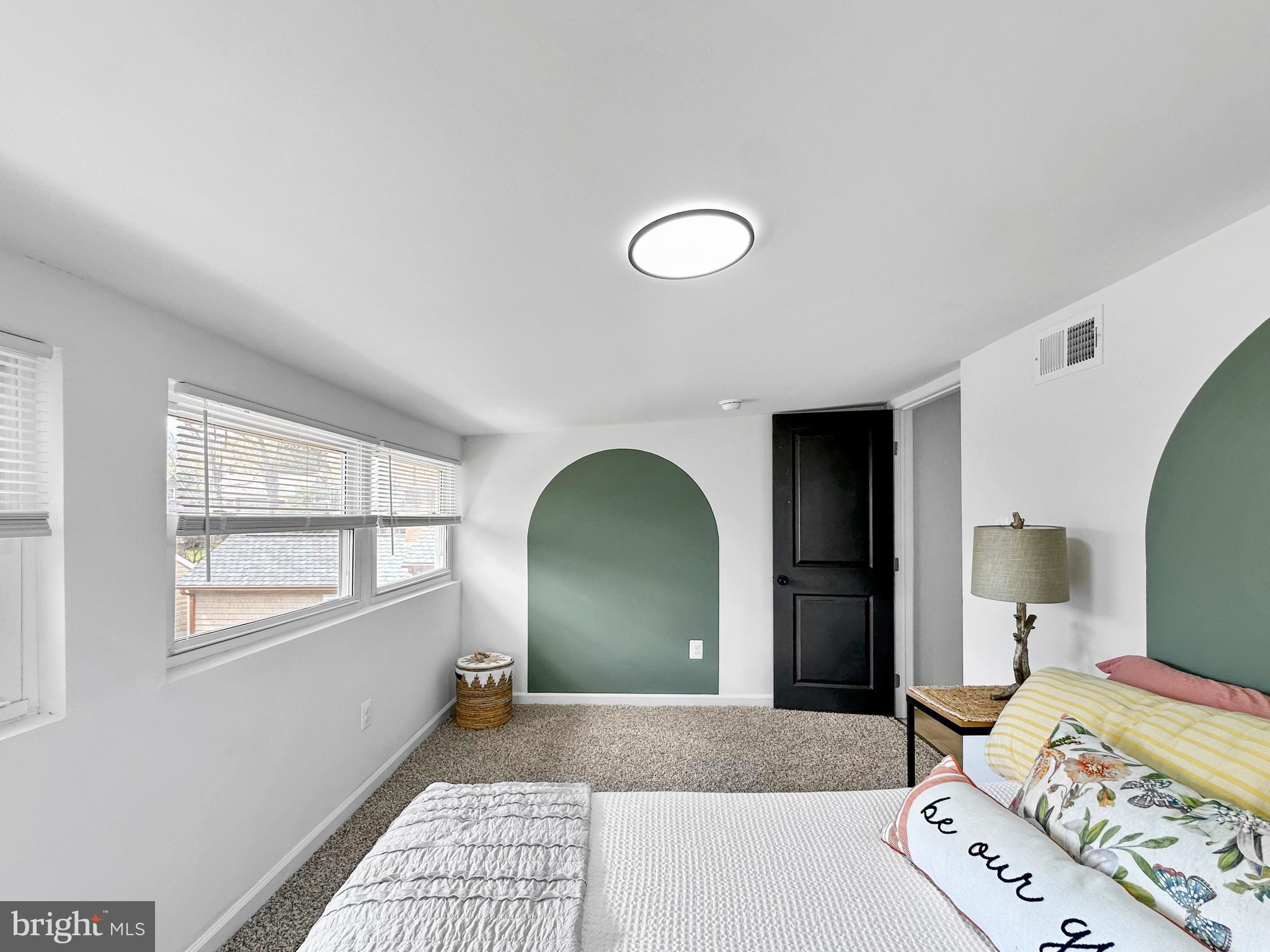 4309 Queensbury Road Riverdale, MD 20737 - Photo 42 of 63 a bedroom with a bed and a window