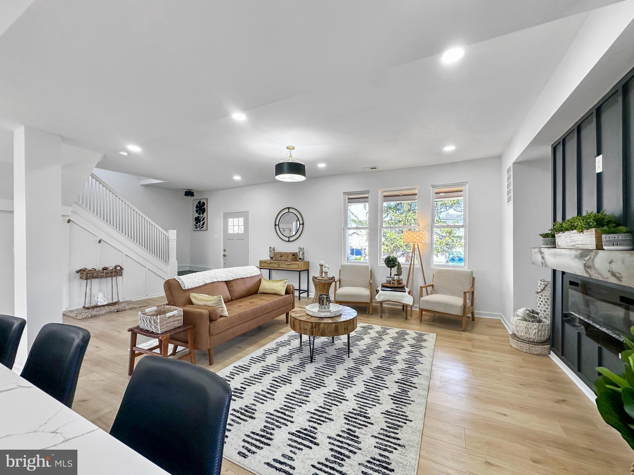 4309 Queensbury Road Riverdale, MD 20737 - Photo 5 of 63 a living room with furniture or couch and a dining table