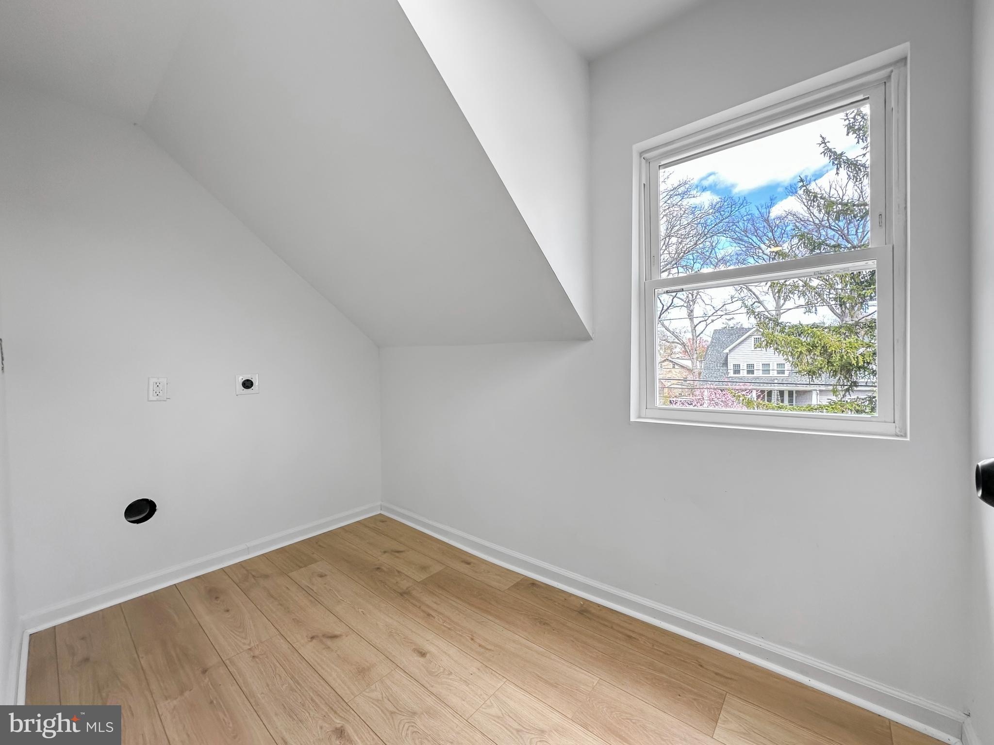 4309 Queensbury Road Riverdale, MD 20737 - Photo 52 of 63 a view of empty room with wooden floor and fan