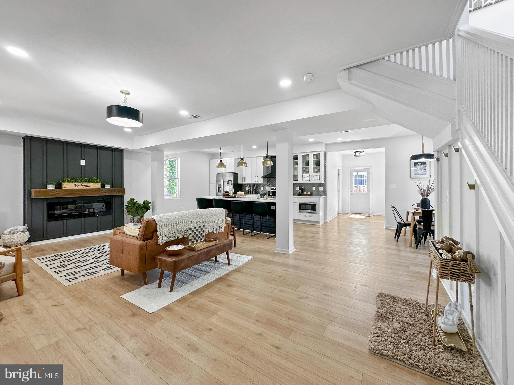 4309 Queensbury Road Riverdale, MD 20737 - Photo 6 of 63 a living room with furniture and wooden floor