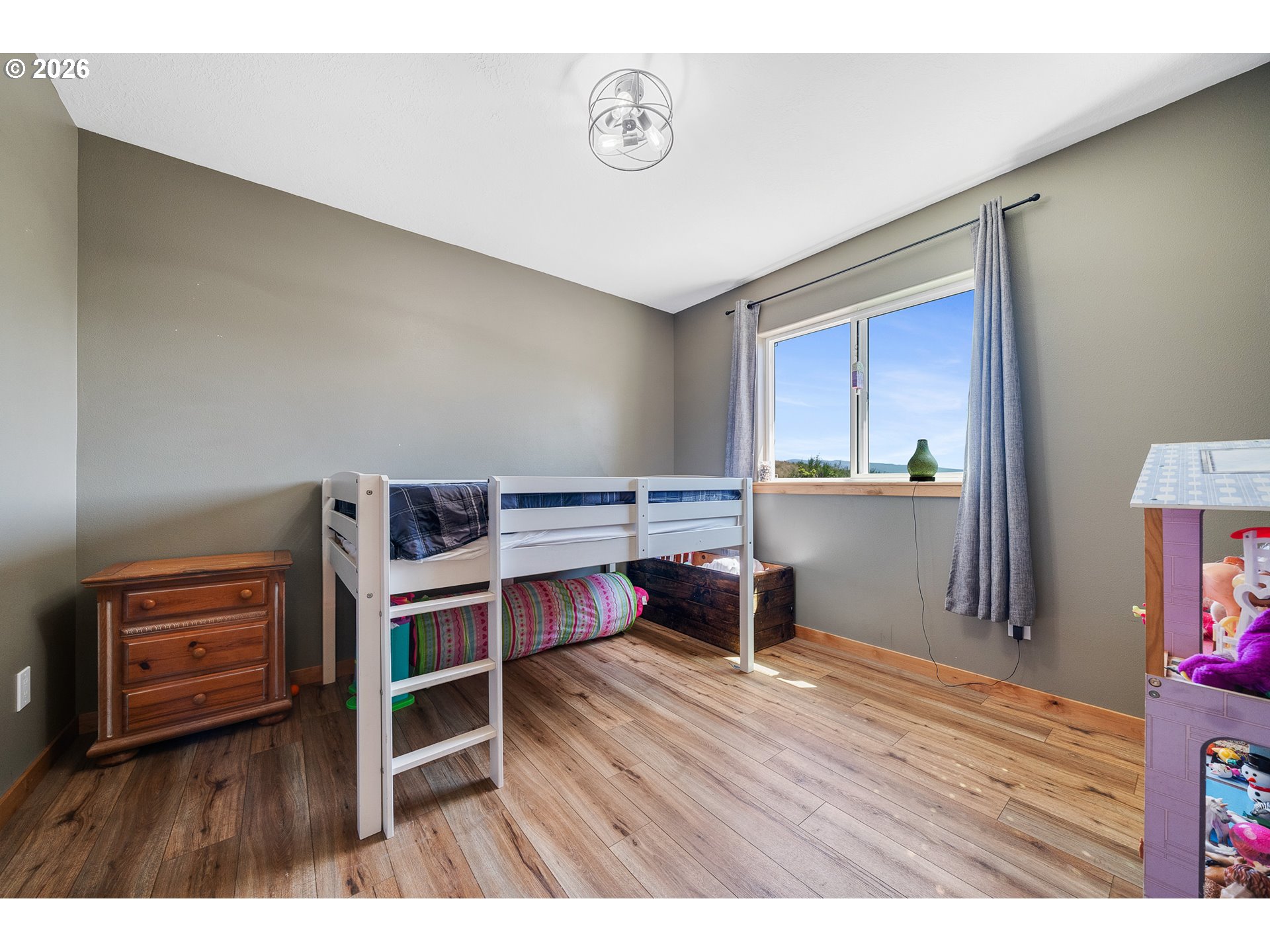 850 Hodgdon Road Tillamook, OR 97141 - Photo 20 of 43 a room with furniture and a wooden floor