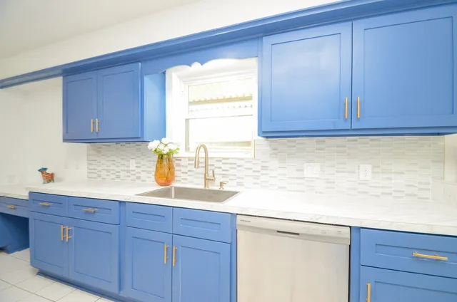 a kitchen with a sink and a window