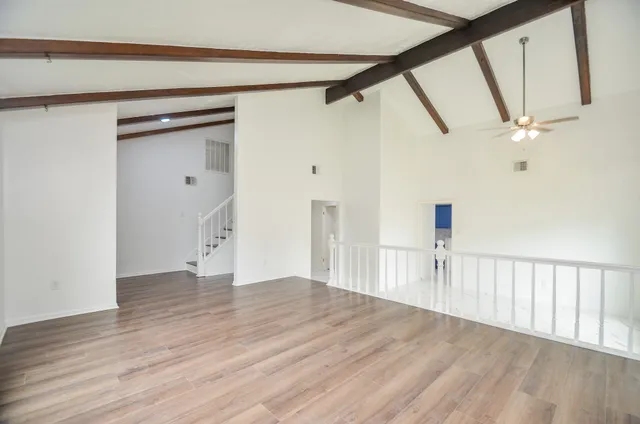 a view of an entryway with wooden floor