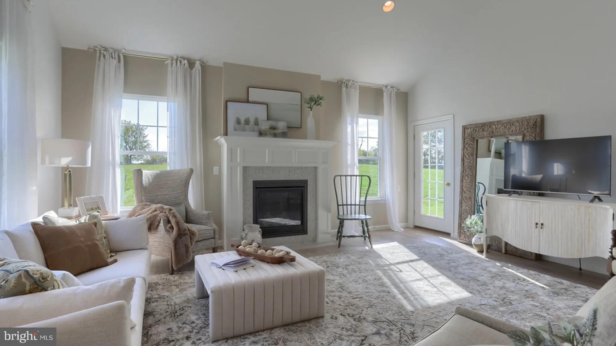 104 Flora Boulevard Lebanon, PA 17042 - Photo 5 of 20 a living room with furniture a flat screen tv and a fireplace