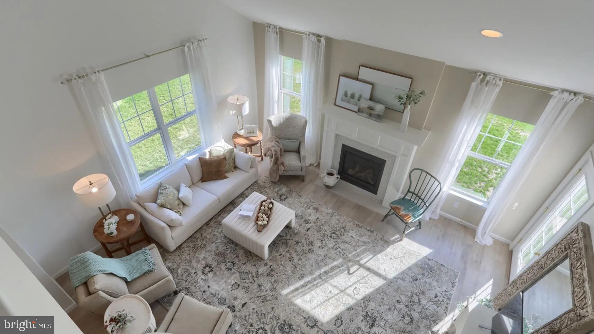 104 Flora Boulevard Lebanon, PA 17042 - Photo 9 of 20 a living room with furniture a fireplace and a large window