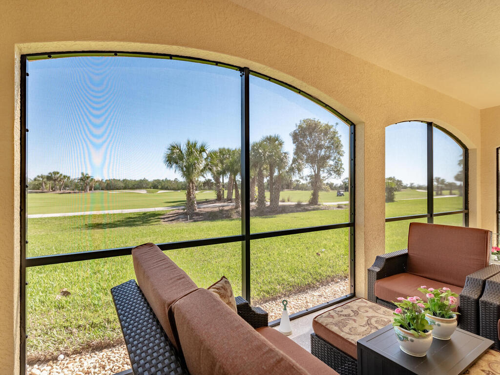 1276 Rialto Way, Unit 102 Naples, FL 34114 - Photo 11 of 37 a view of a city from a balcony