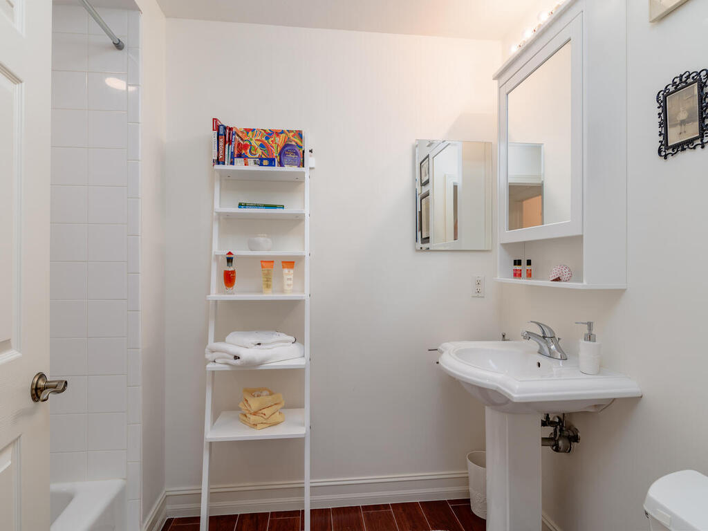 1276 Rialto Way, Unit 102 Naples, FL 34114 - Photo 20 of 37 a bathroom with a sink and a mirror