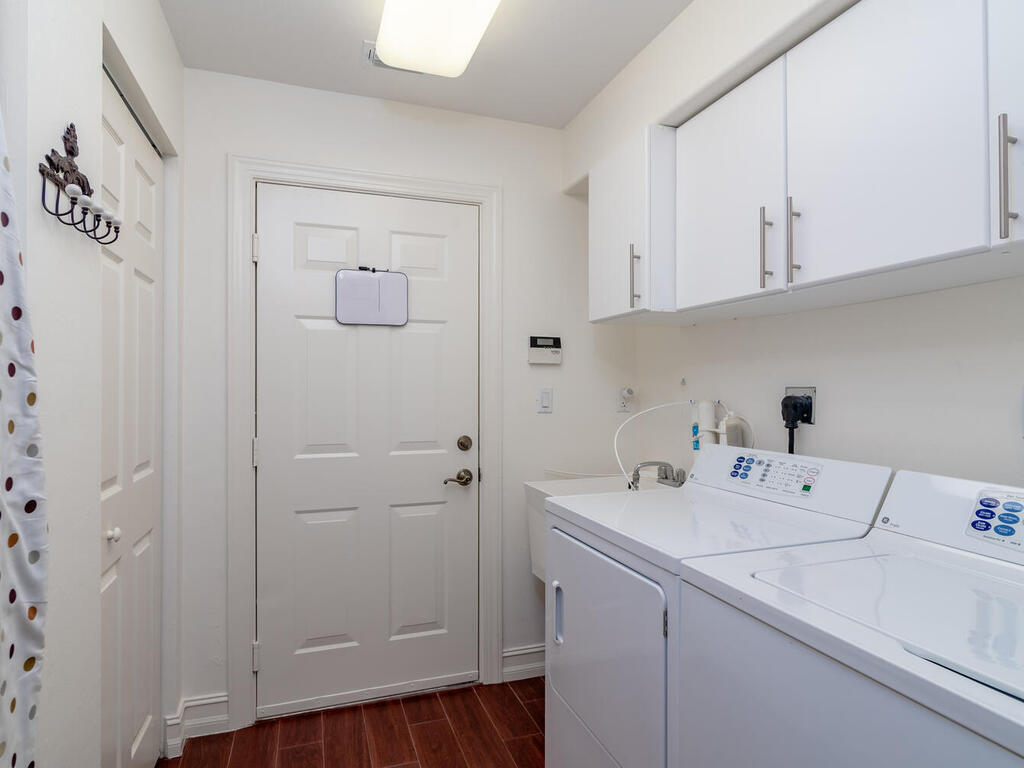 1276 Rialto Way, Unit 102 Naples, FL 34114 - Photo 22 of 37 a room with a sink and cabinets