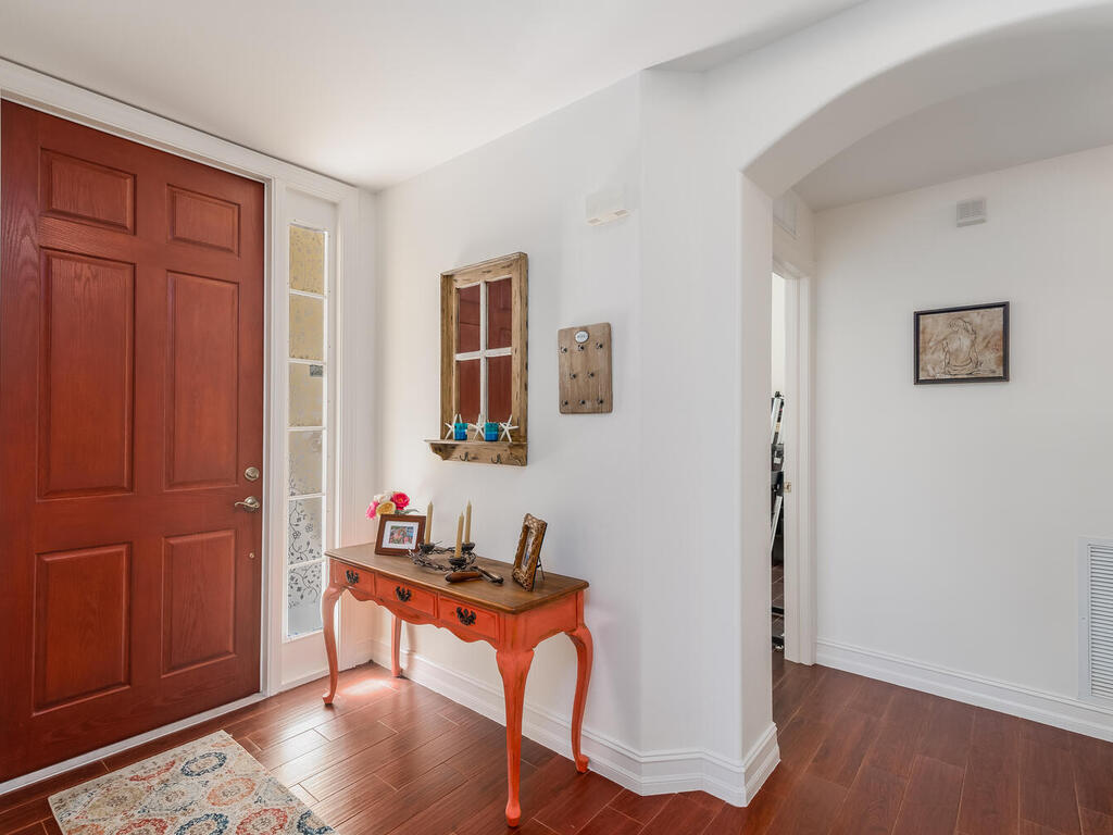1276 Rialto Way, Unit 102 Naples, FL 34114 - Photo 23 of 37 a workspace with furniture and wooden floor