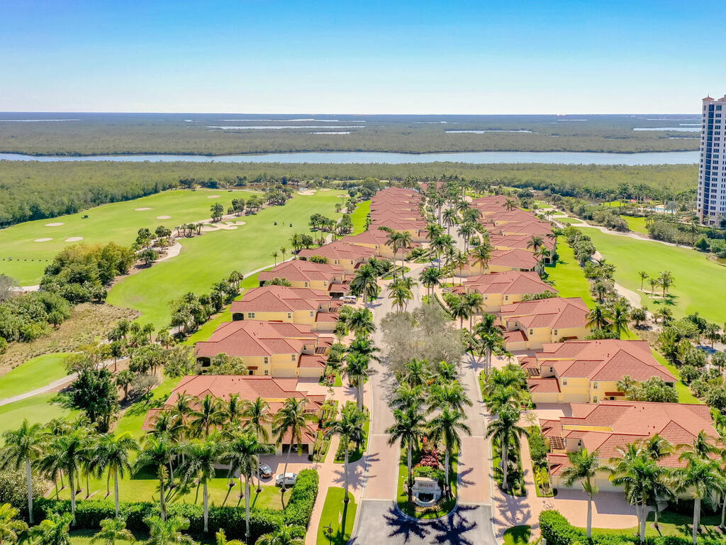 1276 Rialto Way, Unit 102 Naples, FL 34114 - Photo 24 of 37 a view of an ocean and beach