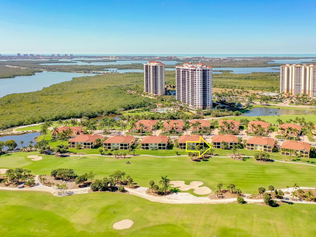 1276 Rialto Way, Unit 102 Naples, FL 34114 - Photo 27 of 37 a view of a city with an ocean