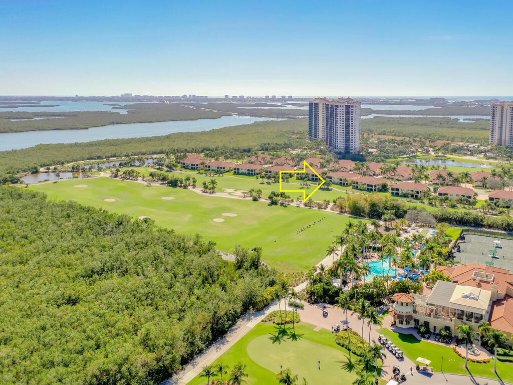 1276 Rialto Way, Unit 102 Naples, FL 34114 - Photo 29 of 37 a view of a city with an ocean view