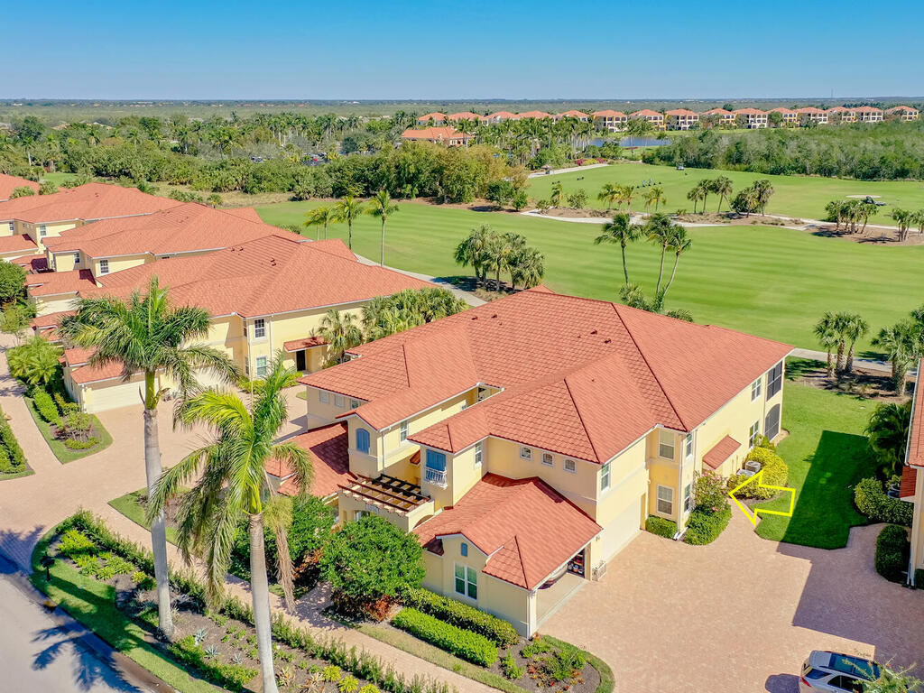 1276 Rialto Way, Unit 102 Naples, FL 34114 - Photo 30 of 37 an aerial view of a house with outdoor space and street view