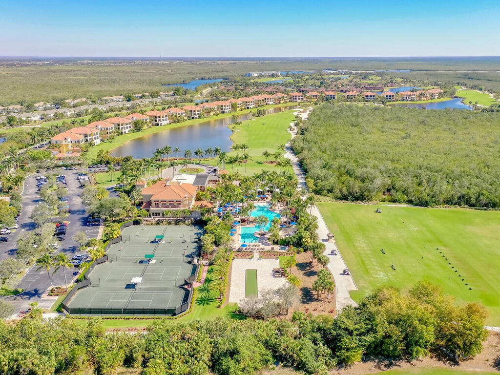 1276 Rialto Way, Unit 102 Naples, FL 34114 - Photo 33 of 37 an aerial view of ocean residential houses with outdoor space and swimming pool