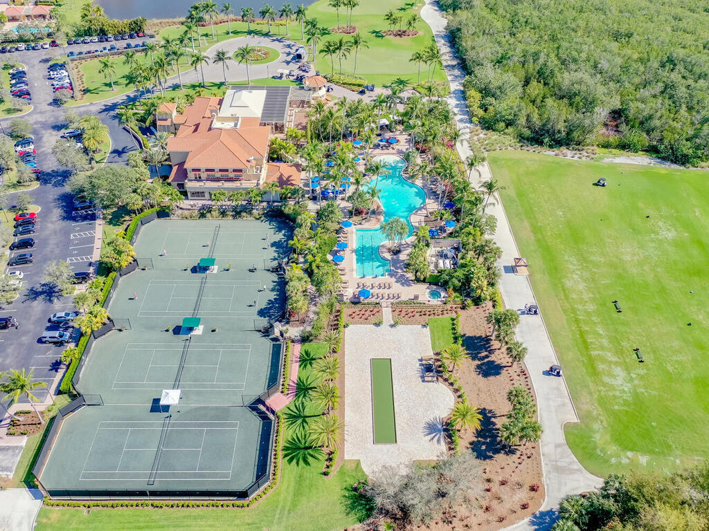 1276 Rialto Way, Unit 102 Naples, FL 34114 - Photo 34 of 37 an aerial view of residential houses with outdoor space and street view