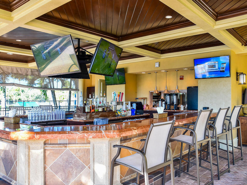 1276 Rialto Way, Unit 102 Naples, FL 34114 - Photo 37 of 37 a outdoor space with lots of tables and chairs