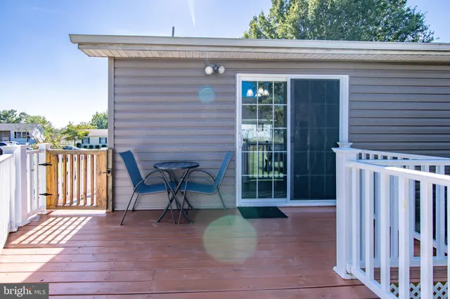 a front view of a house with outdoor seating