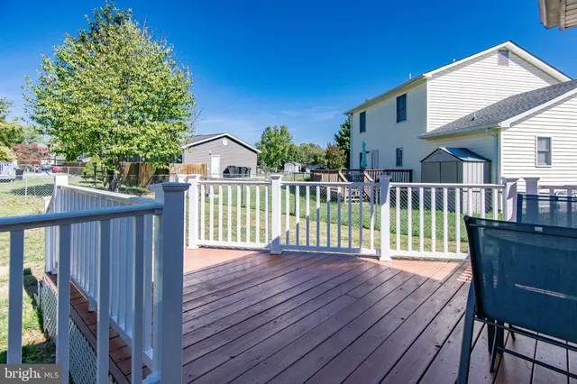 a view of a wooden deck with a bench