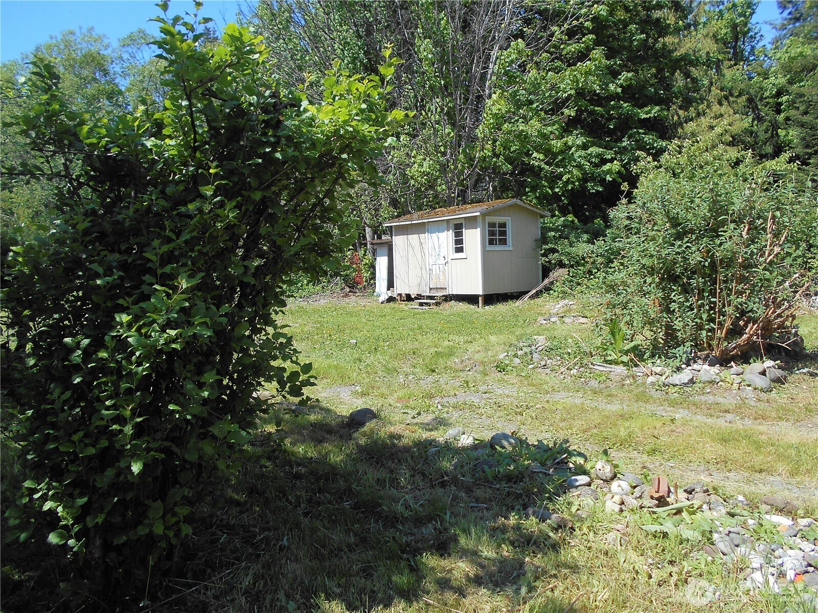 170 Kelly Road Brinnon, WA 98320 - Photo 17 of 29 a view of a house with a yard