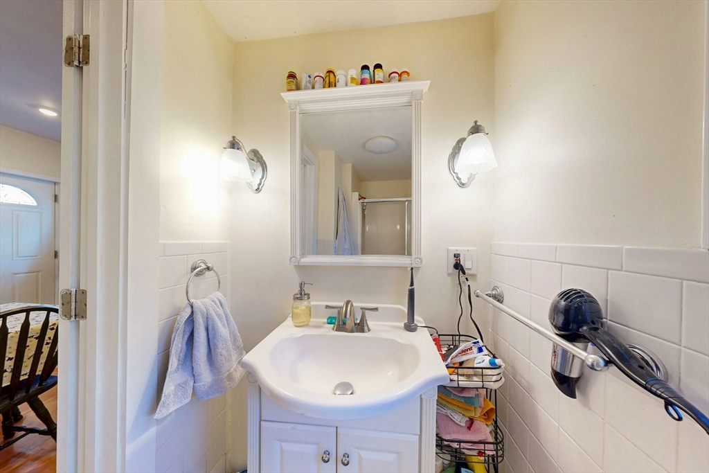 58 Dearborn Street Medford, MA 02155 - Photo 15 of 38 a bathroom with a sink and a mirror