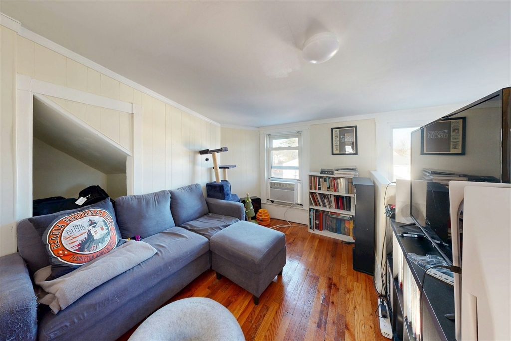 58 Dearborn Street Medford, MA 02155 - Photo 28 of 38 a living room with furniture and a flat screen tv