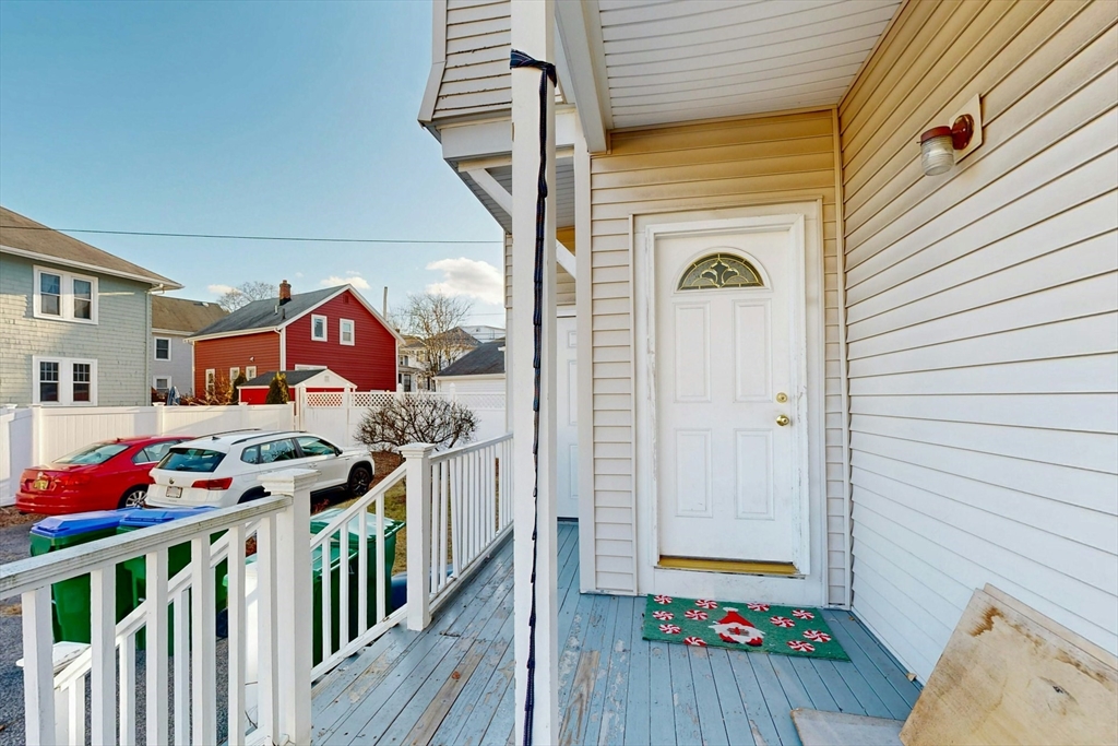 58 Dearborn Street Medford, MA 02155 - Photo 4 of 38 a front view of a house with wooden floor