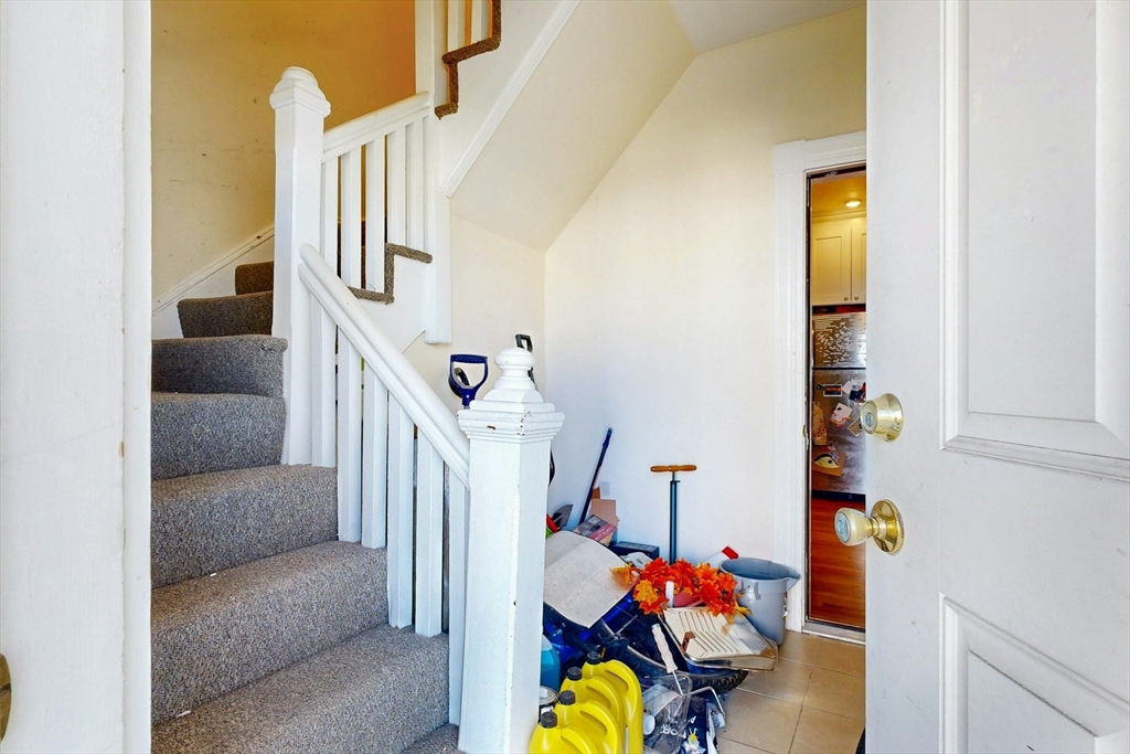 58 Dearborn Street Medford, MA 02155 - Photo 6 of 38 a living room with furniture and stairs