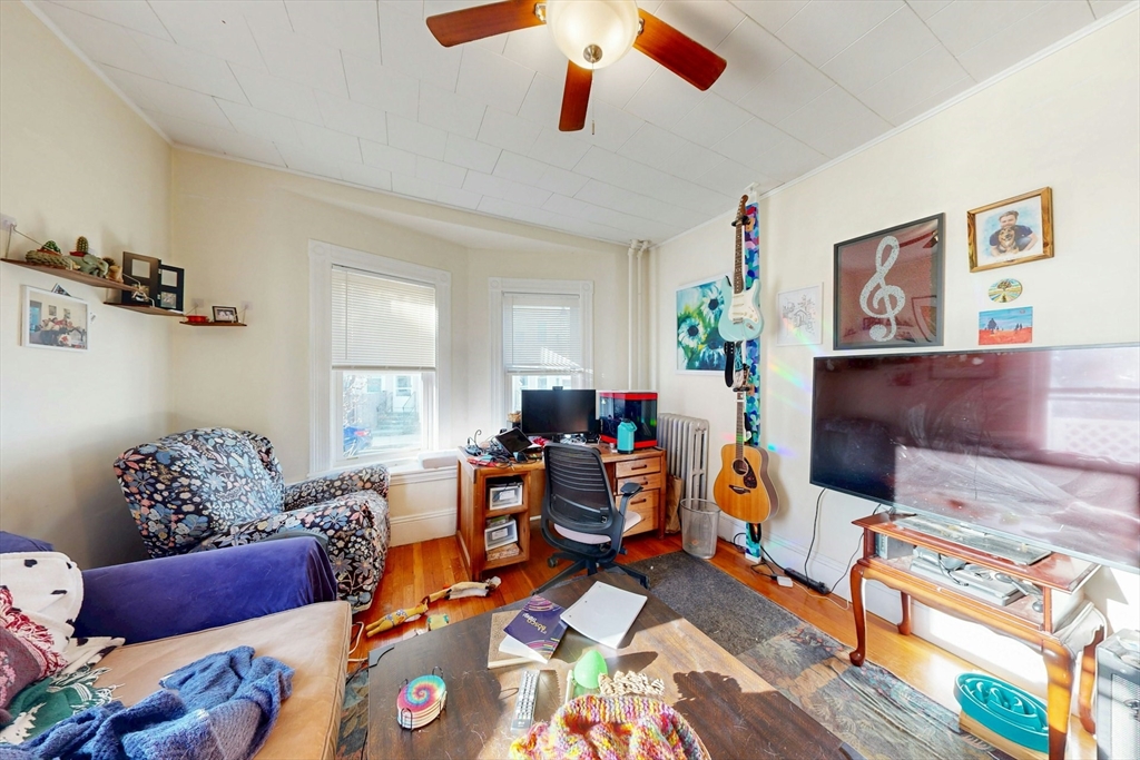 58 Dearborn Street Medford, MA 02155 - Photo 7 of 38 a living room with furniture and wooden floor
