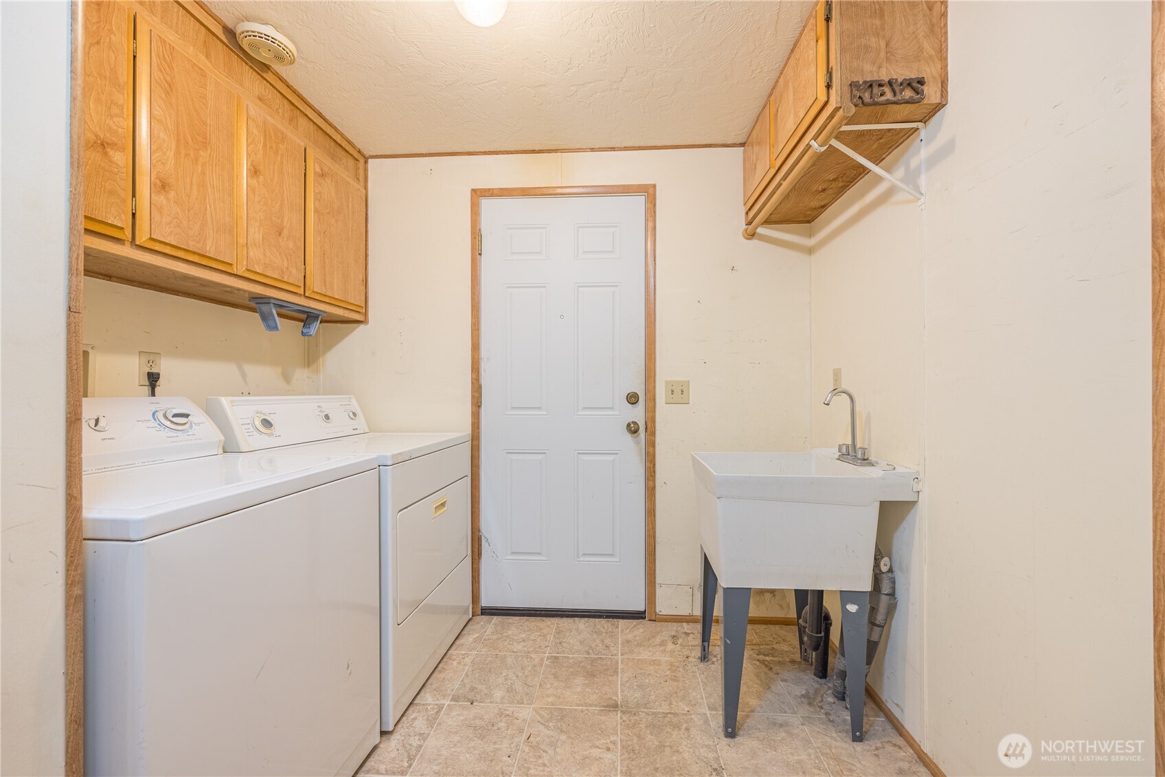 20 Ed's Place Sequim, WA 98382 - Photo 21 of 30 a utility room with dryer and washer