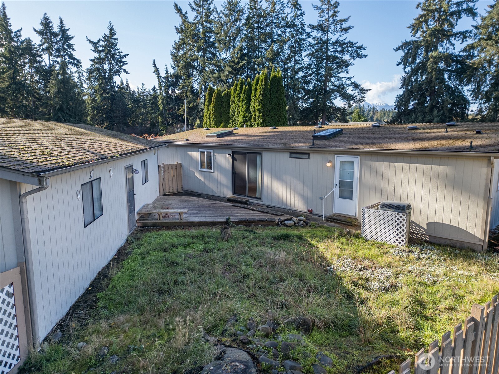 20 Ed's Place Sequim, WA 98382 - Photo 23 of 30 a view of a house with a yard and sitting area