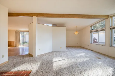 a view of an empty room and window