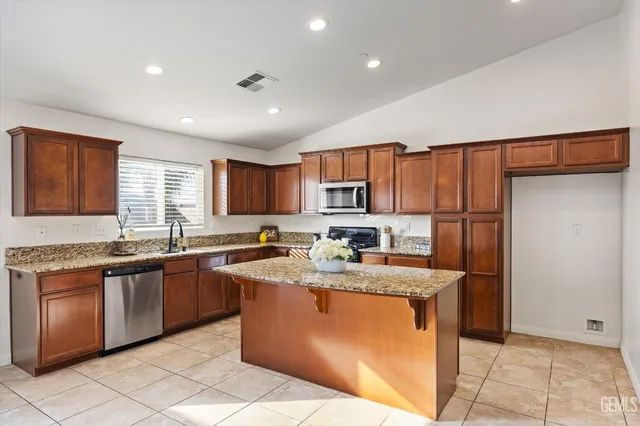 a view of bathroom with a sink and mirror