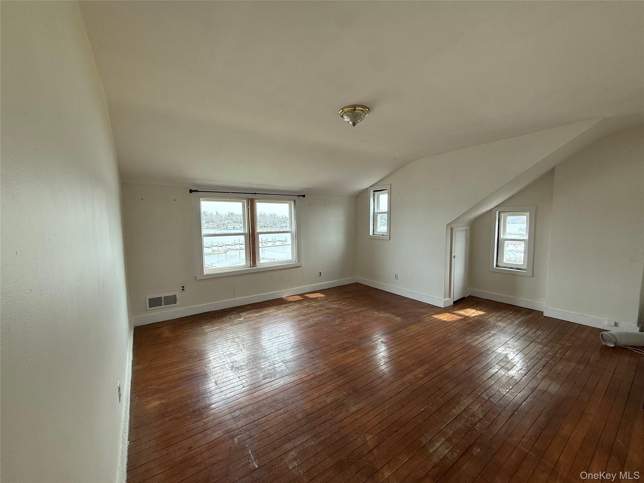307 West Shore Road, Unit 5 Huntington, NY 11743 - Photo 2 of 12 Living room with wood floors and natural light