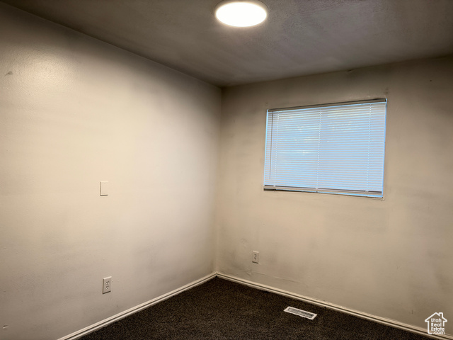 420 North 200 West Logan, UT 84321 - Photo 11 of 13 Spare room with carpet and baseboards