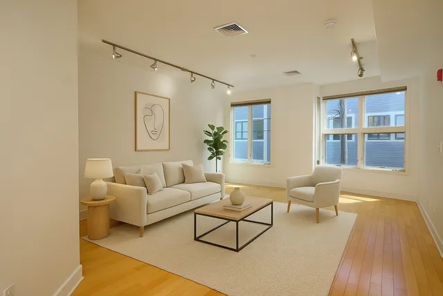 a living room with furniture and a table