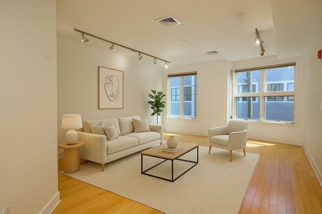 a living room with furniture and a table