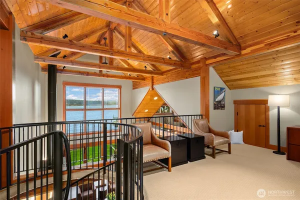 a view of staircase with furniture and wooden floor