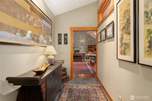 a view of living room with furniture and a rug