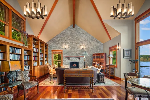 a living room with patio furniture and a chandelier