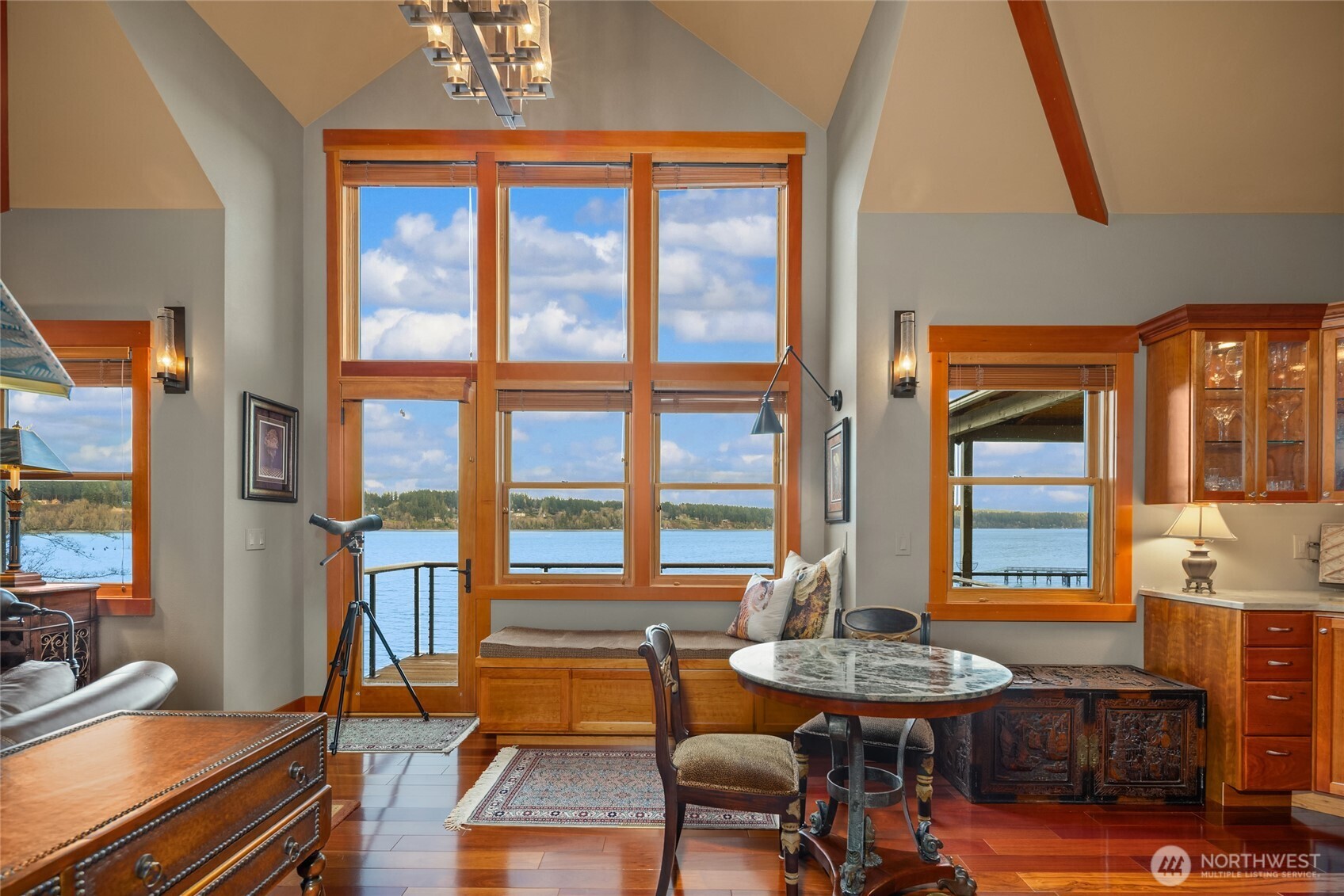 15550 Sandy Hook Road Northeast Poulsbo, WA 98370 - Photo 18 of 40 a living room with furniture and a window
