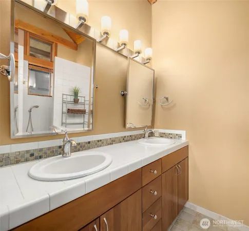 a bathroom with a sink and a mirror
