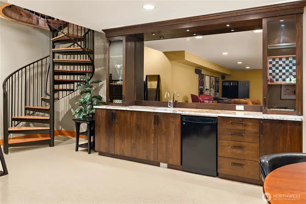 a living room with furniture a flat screen tv and a dining table