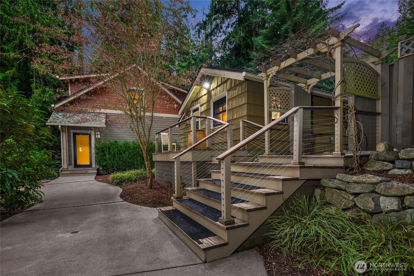 15550 Sandy Hook Road Northeast Poulsbo, WA 98370 - Photo 25 of 40 a house with trees in front of it